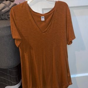 Orange V-neck shirt, size XS great condition.